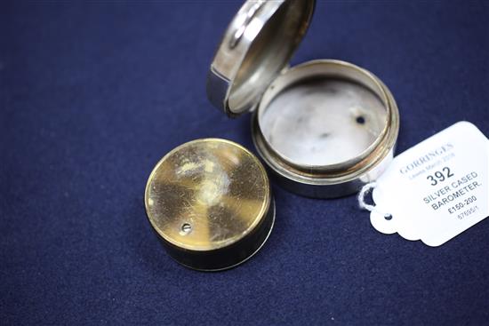 A late Victorian silver cased brass pocket barometer, 2.25in.